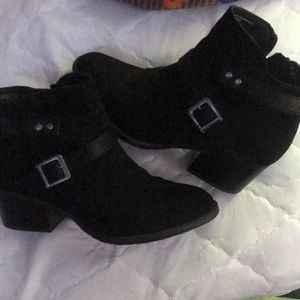 Black ankle zip up boots with a tiny heel